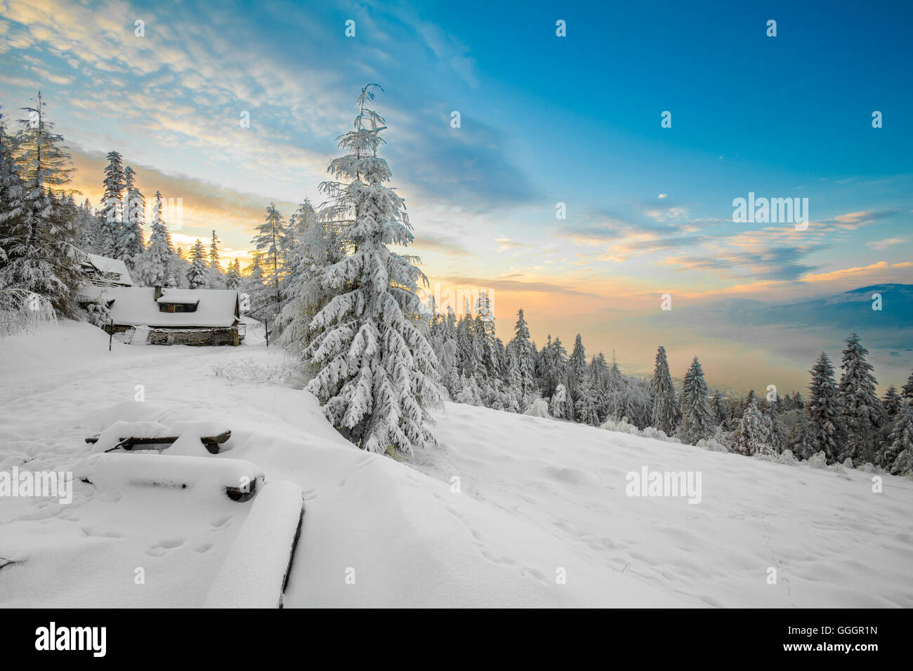 Beautiful winter sunrise photo taken in polish Beskidy mountains - Rogacz hill. View on Skrzyczne mountain. Stock Photo