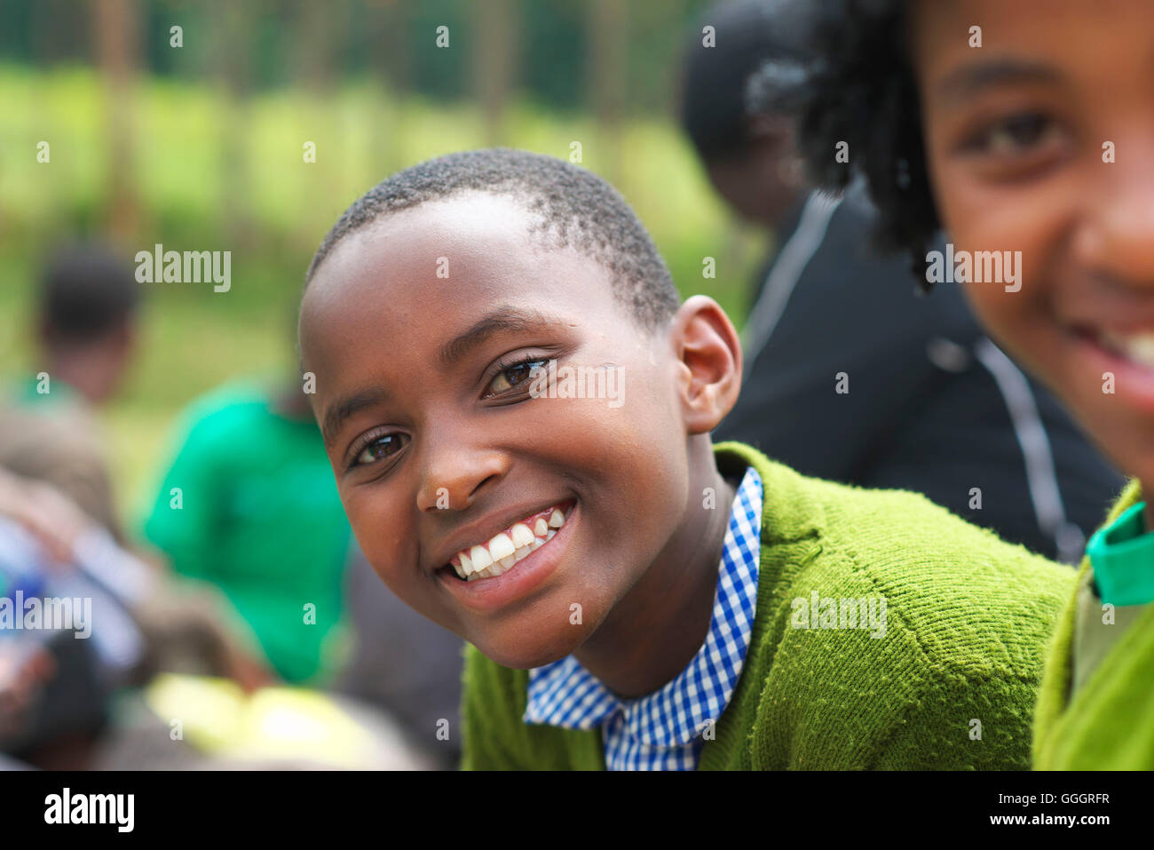 Young Ugandan female school child smiles at camera Stock Photo