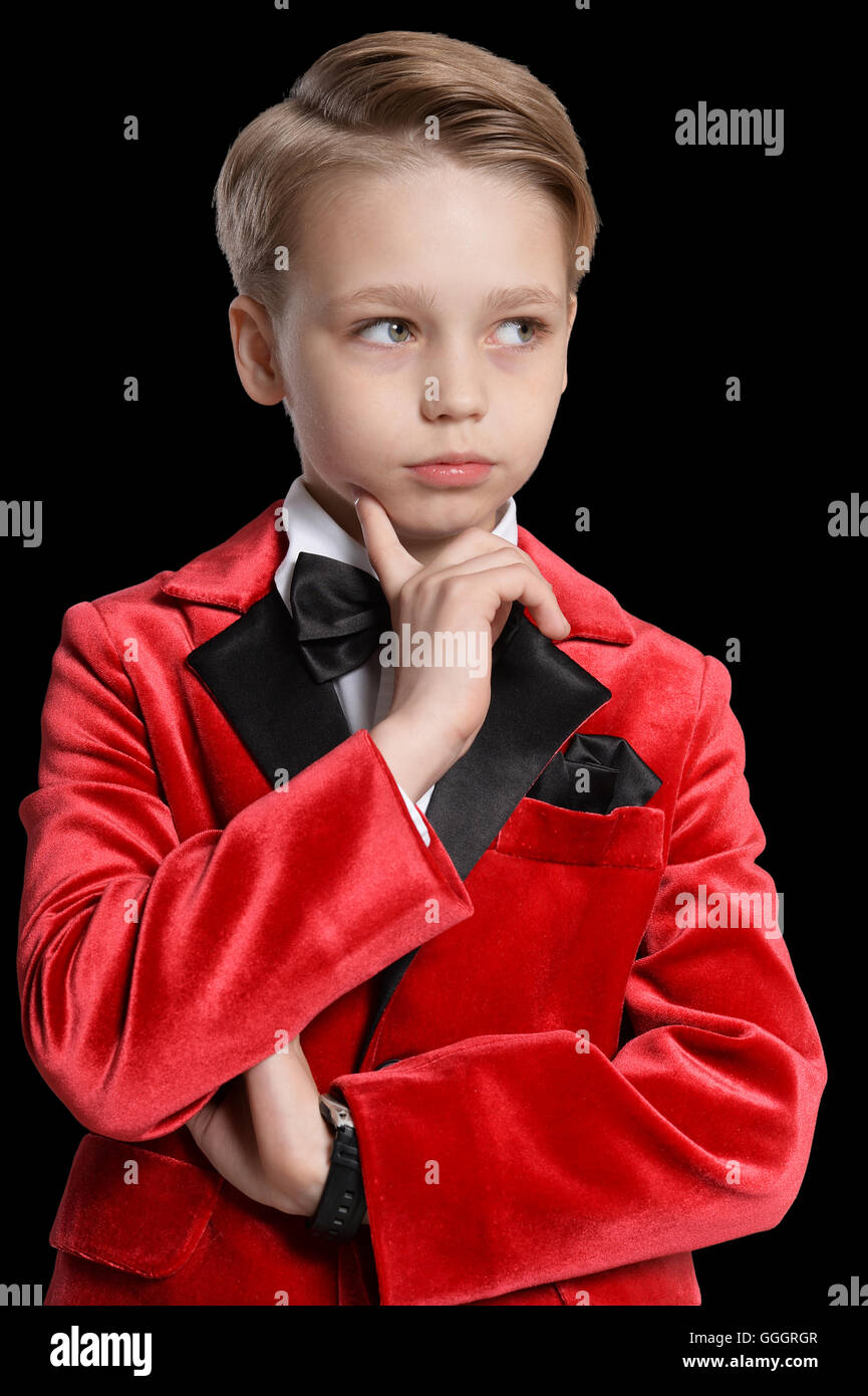serious little boy in a tuxedo Stock Photo Alamy