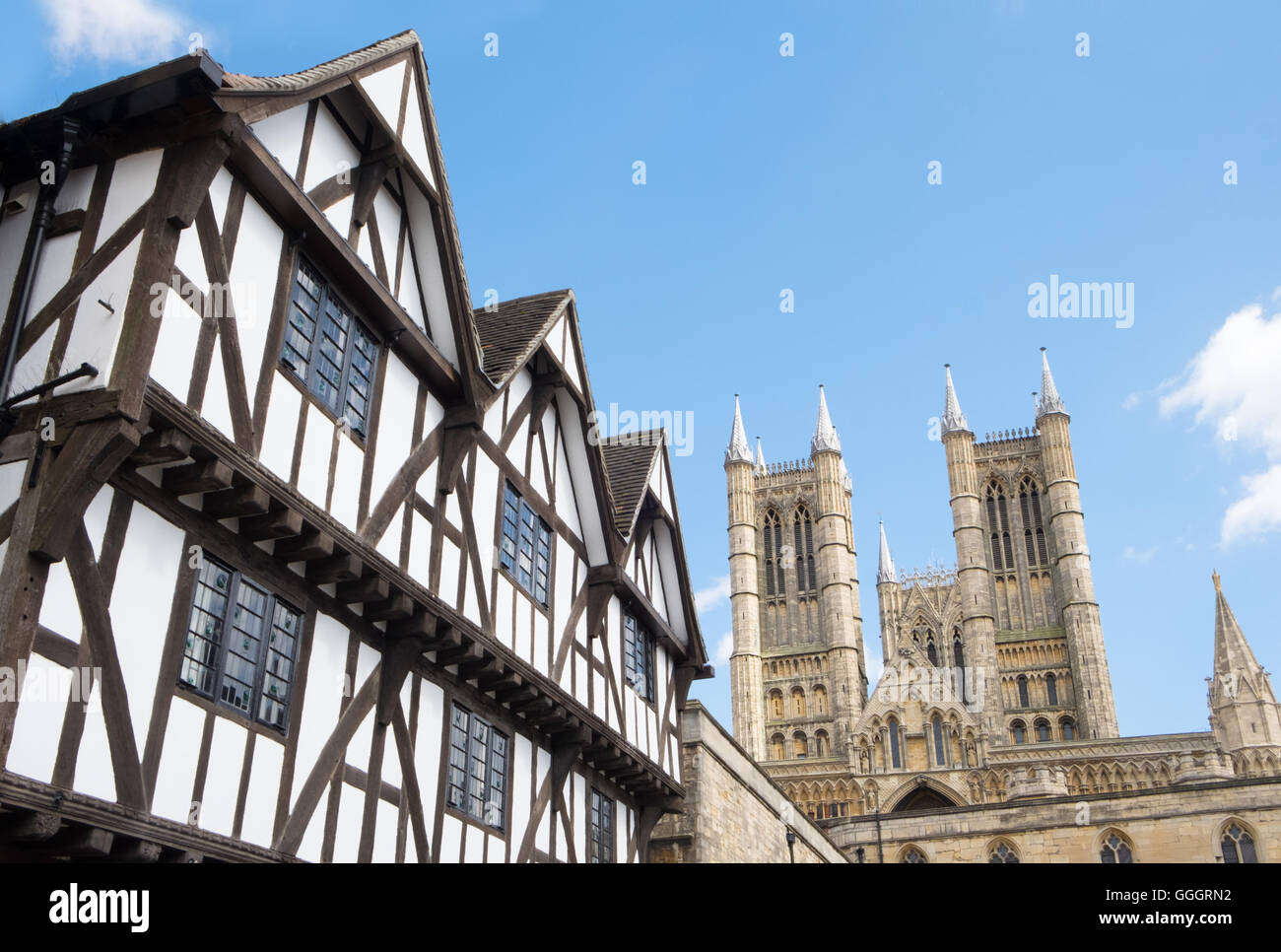 Half timbered house and Lincoln cathedral Stock Photo