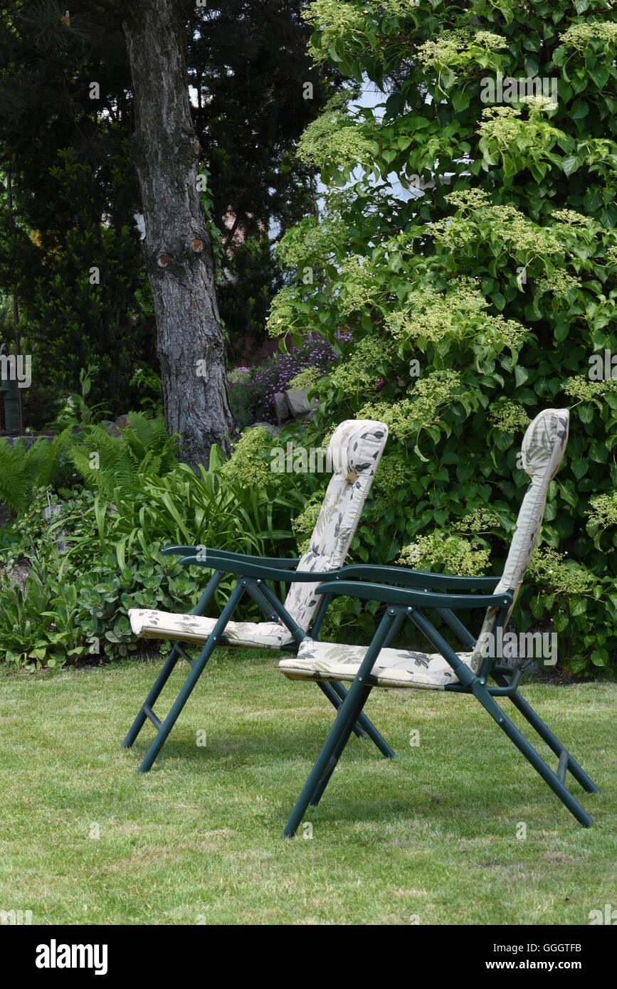 Garden chairs in the garden Stock Photo Alamy