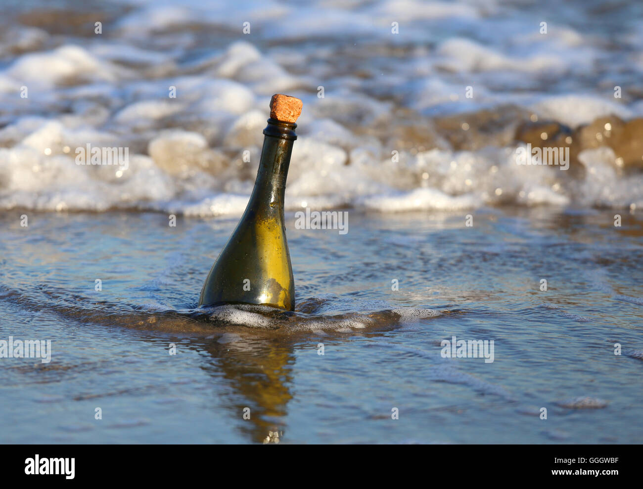 Secret Message in the bottle on the beach of ocean Stock Photo - Alamy