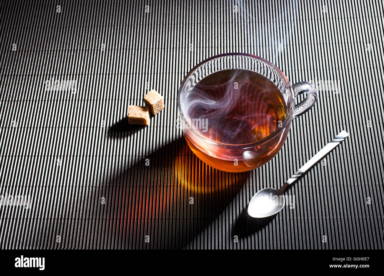 teacup with the reflection of the background structure. Stock Photo