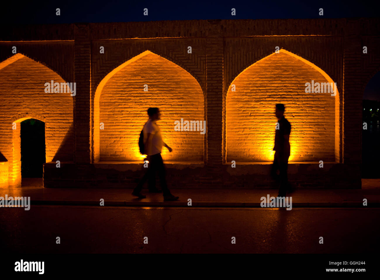 People walk by the  Si-o-seh pol bridge in Isfahan, Iran. © Jordi Boixareu Stock Photo