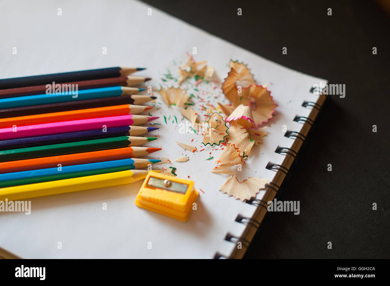 sharpened colored pencils, sharpener and shavings Stock Photo Alamy