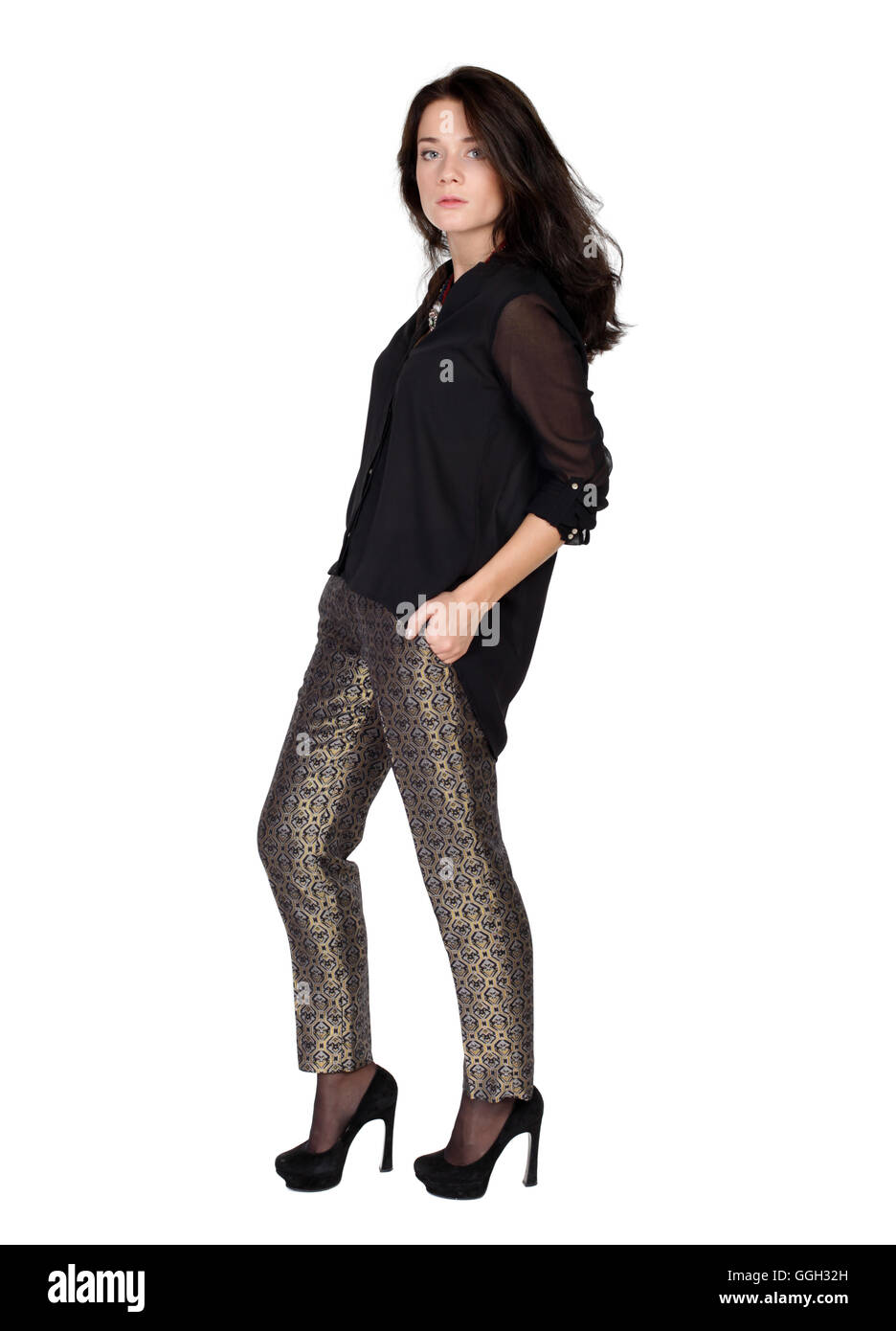 fashion portrait of a girl in trousers and a black blouse Stock Photo ...