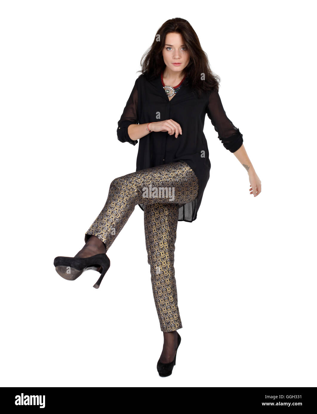 fashion portrait of a girl in trousers and a black blouse Stock Photo ...