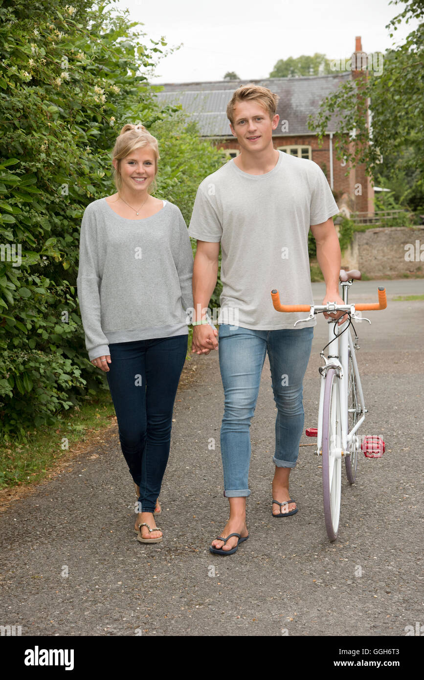 Boy and girl walking holding hands hi-res stock photography and images ...