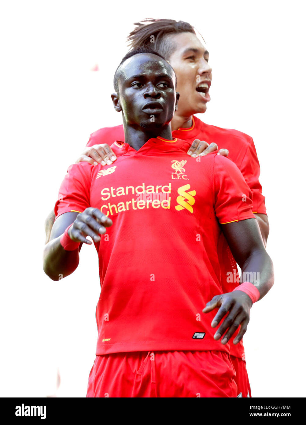 Liverpool's Sadio Mane celebrates scoring his side's first goal of the game with teammate Roberto Firmino during the pre-season friendly match at Wembley Stadium, London. PRESS ASSOCIATION Photo. Picture date: Saturday August 6, 2016. See PA story SOCCER Liverpool. Photo credit should read: Adam Davy/PA Wire. RESTRICTIONS: No use with unauthorised audio, video, data, fixture lists, club/league logos or 'live' services. Online in-match use limited to 75 images, no video emulation. No use in betting, games or single club/league/player publications. Stock Photo