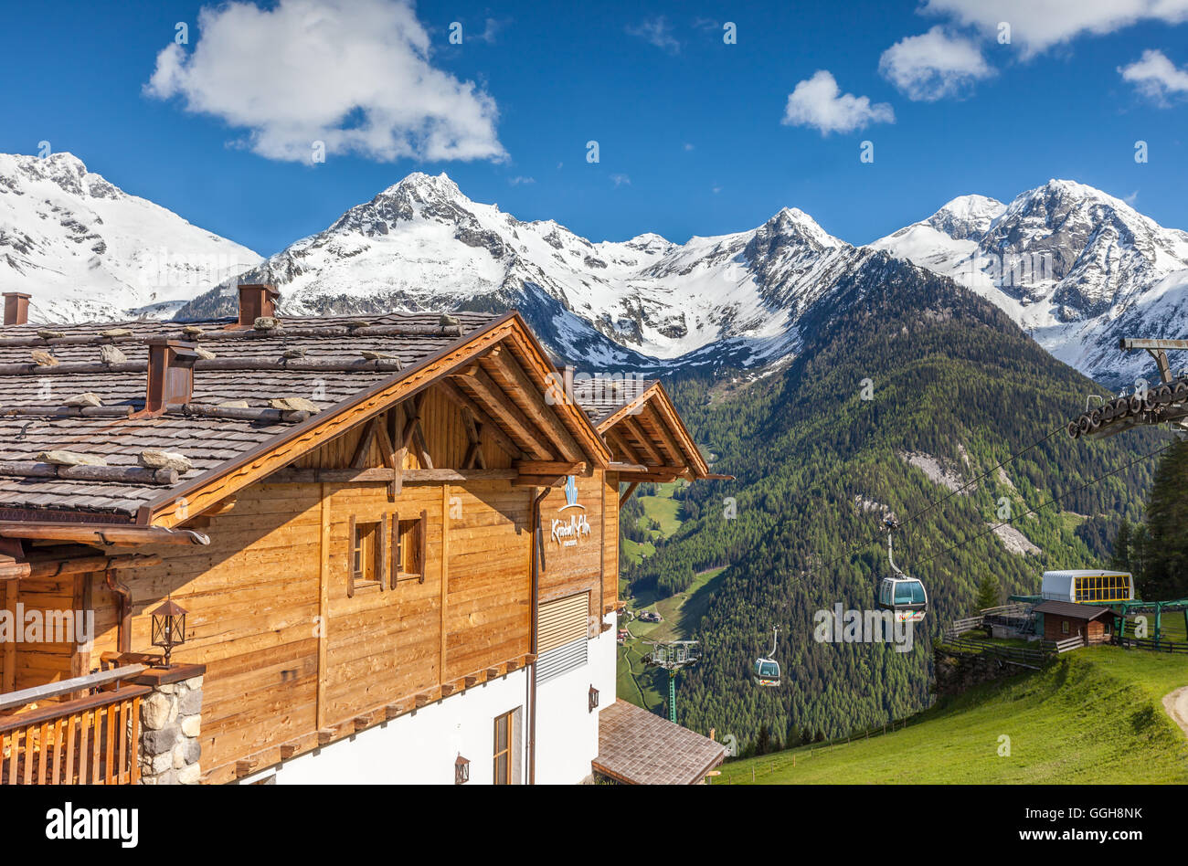geography / travel, Italy, South Tyrol, mountain cabin and snow covered mounts on the Klausberg near stone house, Ahrntal (Ahrn Valley) , Additional-Rights-Clearance-Info-Not-Available Stock Photo