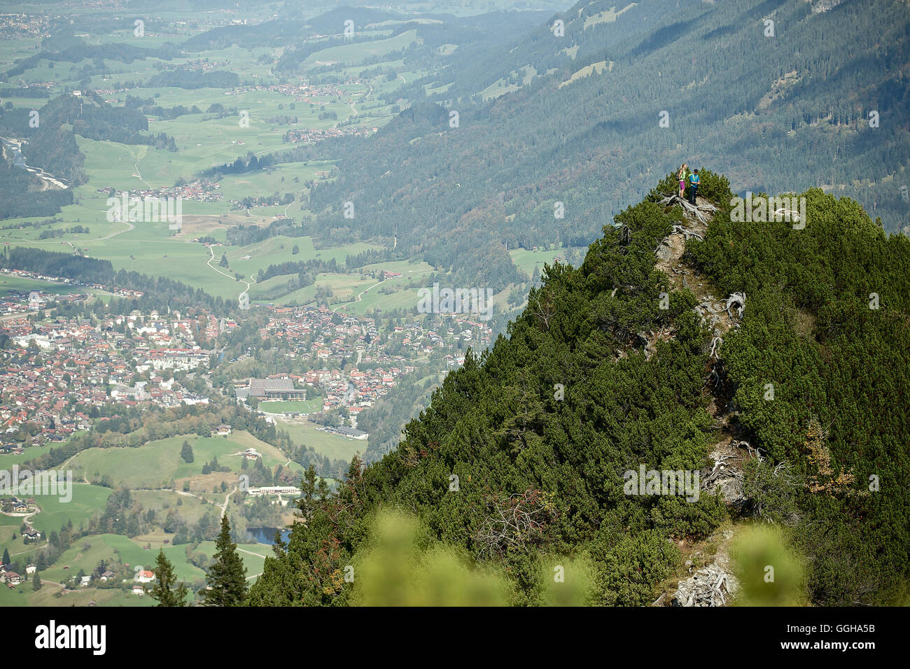 A man and a woman hiking in the mountains, Oberstdorf, Bavaria, Germany Stock Photo