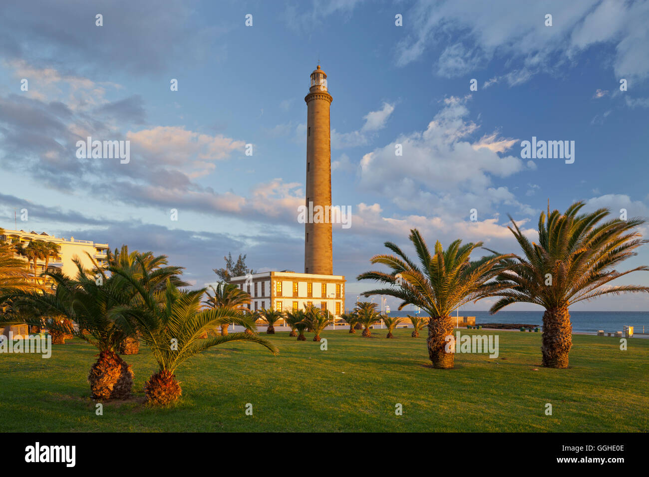 Lighthouse in Maspalomas with palm trees, Gran Canaria, Canary Islands, Spain Stock Photo