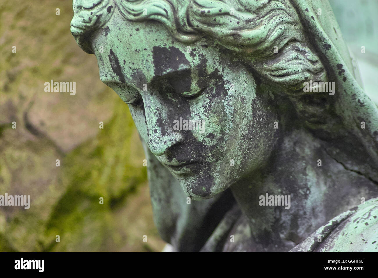 Close up of a Sculpture of a sadly looking woman, girl, grave sculpture, sadly face, sorrowful / Grab-Skulptur, trauernde Frau Stock Photo