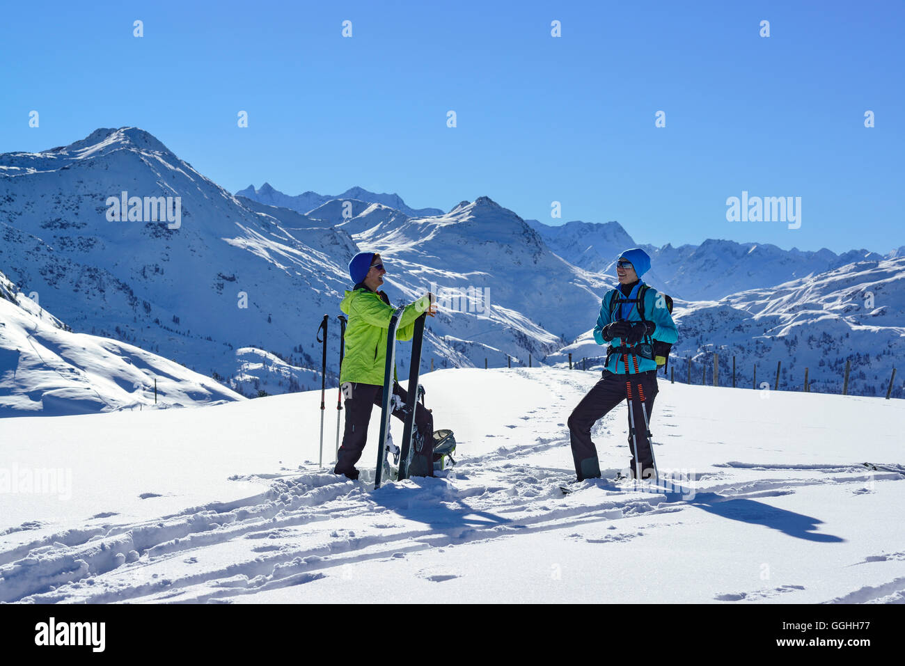 Two female back-country skiers having a rest at Steinberg, Kitzbuehel Alps, Tyrol, Austria Stock Photo