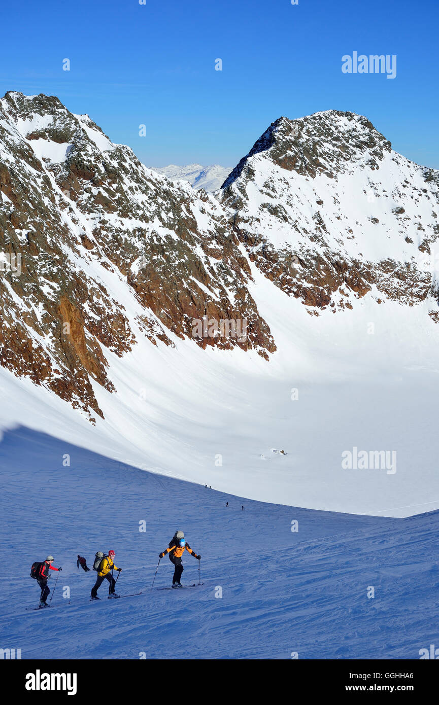 Three back-country skier ascending to Agglsspitze, Pflersch Valley, Stubai Alps, South Tyrol, Italy Stock Photo