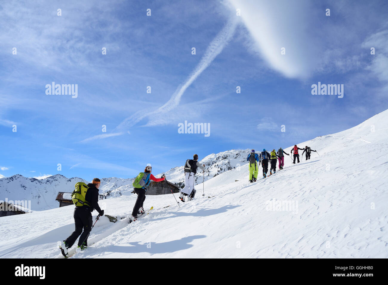 Back-country skiers ascending to Regenfeldjoch, Langer Grund, Kitzbuehel Alps, Tyrol, Austria Stock Photo
