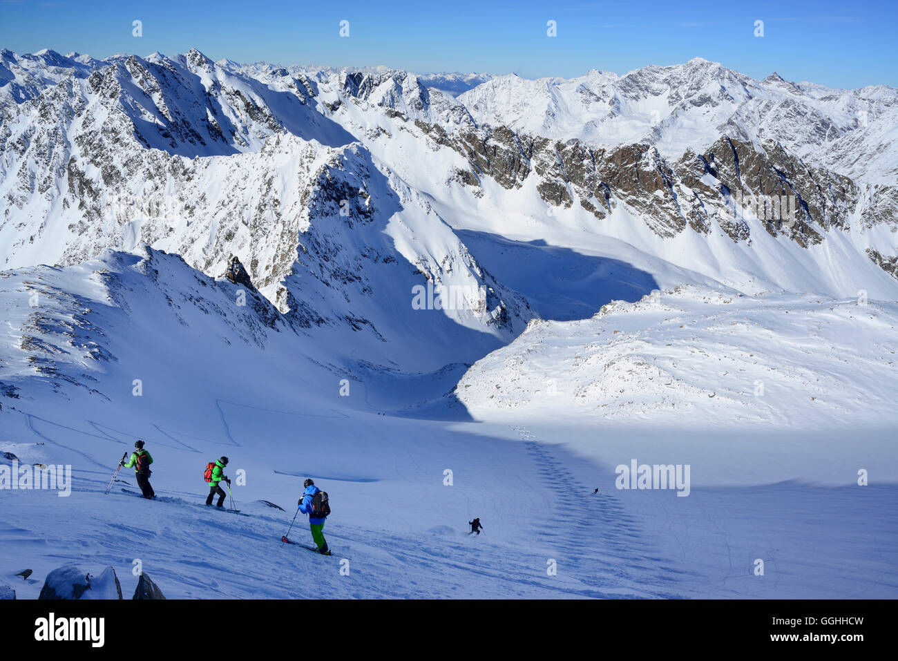 Back-country skier downhill skiing from Kuhscheibe, Stubai Alps, Tyrol, Austria Stock Photo