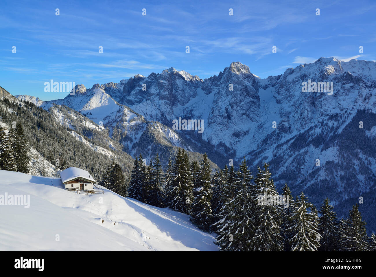 Snow-covered alpine hut in front of mountain scenery, Wilder Kaiser, Kaiser Mountains, Tyrol, Austria Stock Photo
