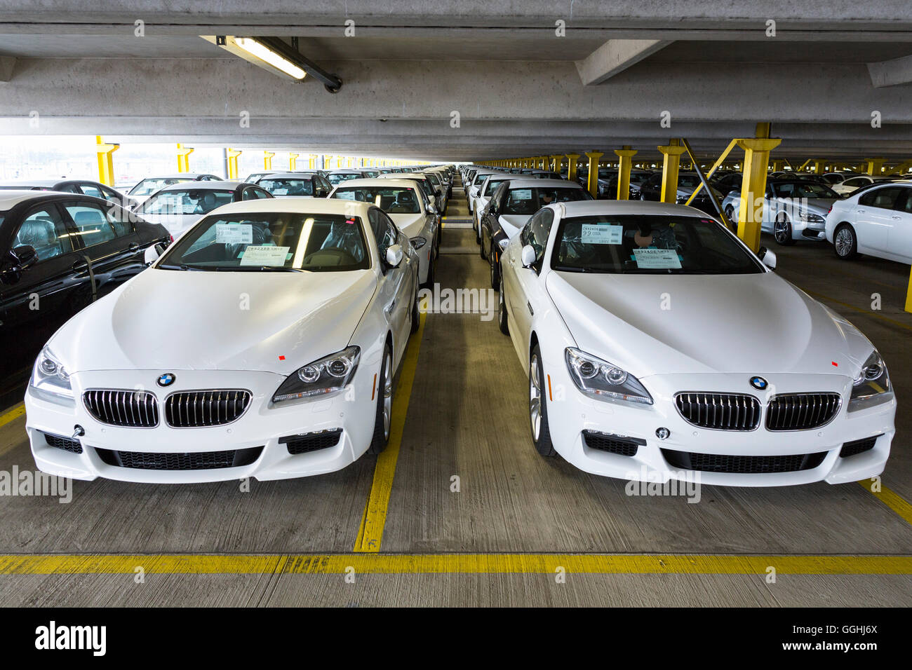 New cars in a parking garage before shipping in Bremerhaven, Germany Stock Photo