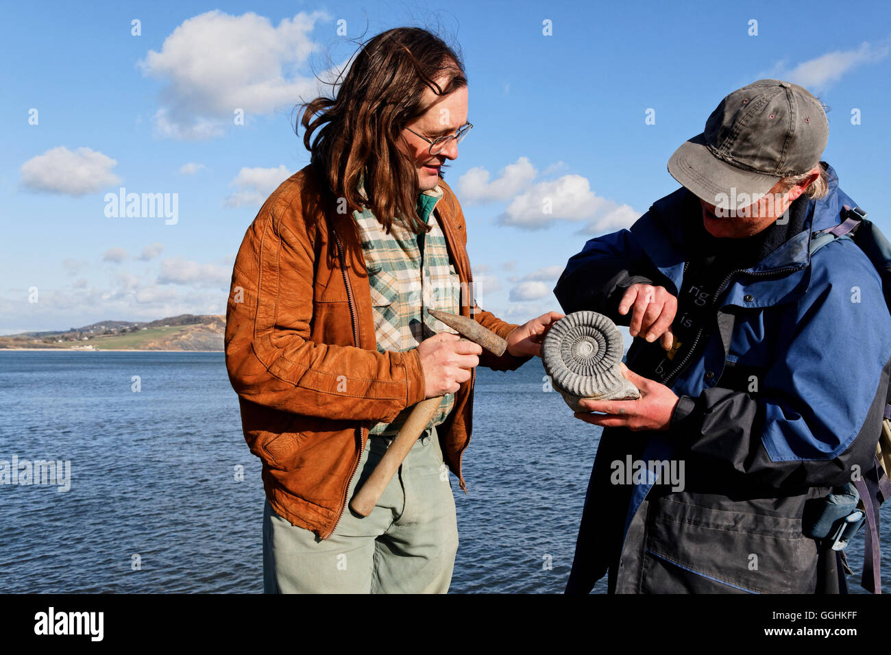 Fossile hunter with fossil, Lyme Regis, Dorset, England, Great Britain Stock Photo