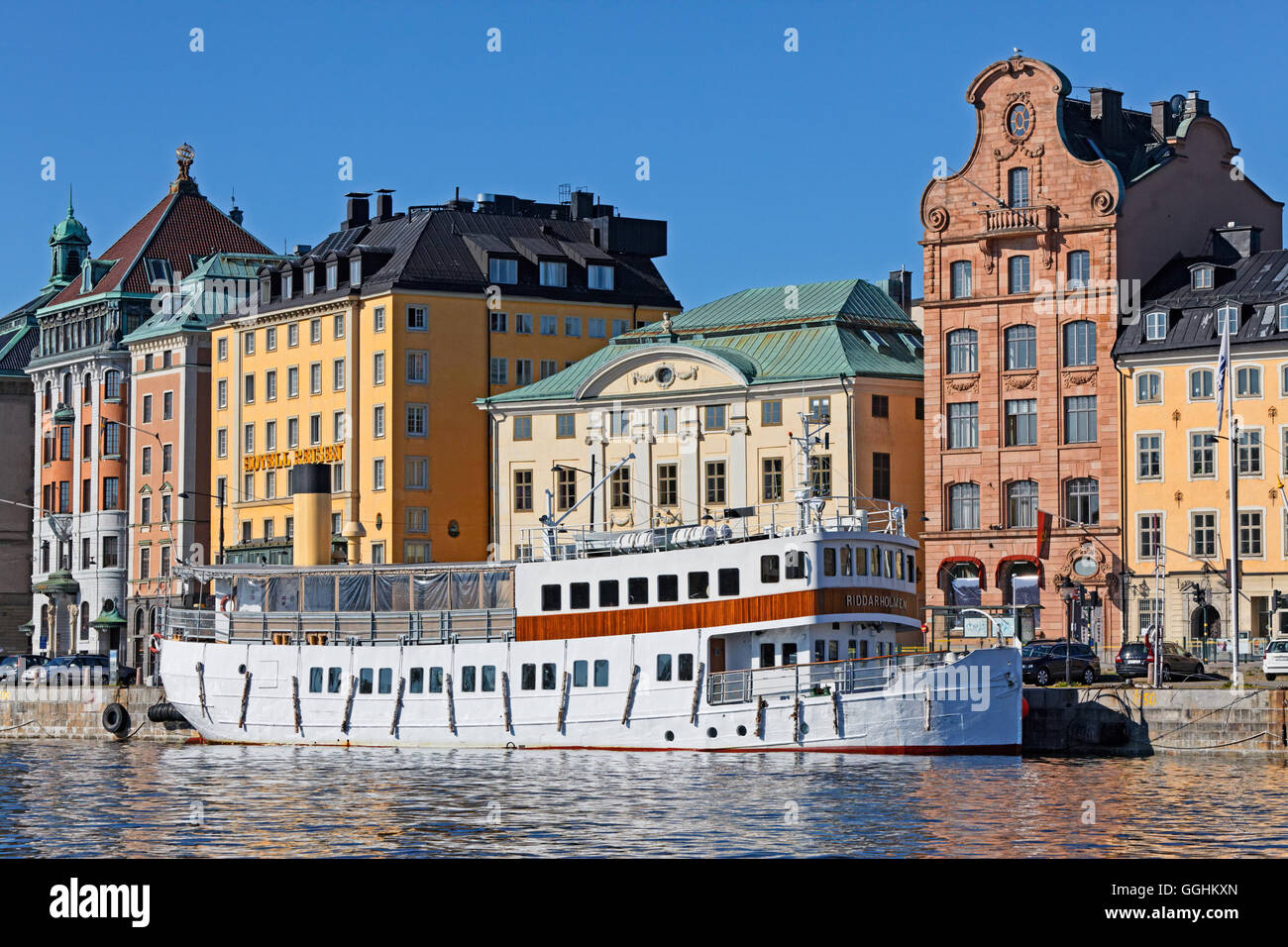 Excursion boat at Skeppsholm quay of Gamla Stan, Stockholm, Sweden Stock Photo