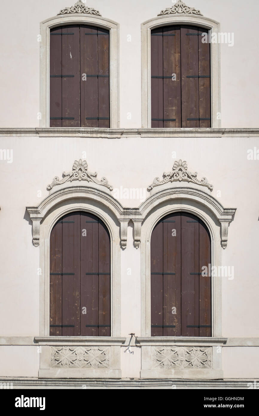 Decorated arched windows of a medieval building Stock Photo - Alamy