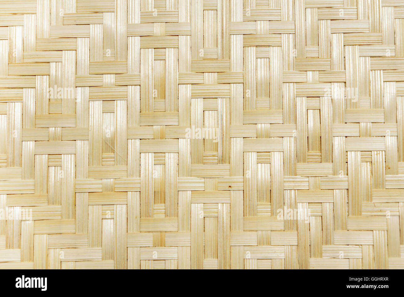 Yellow bamboo wicker weave closeup background texture pattern Stock Photo