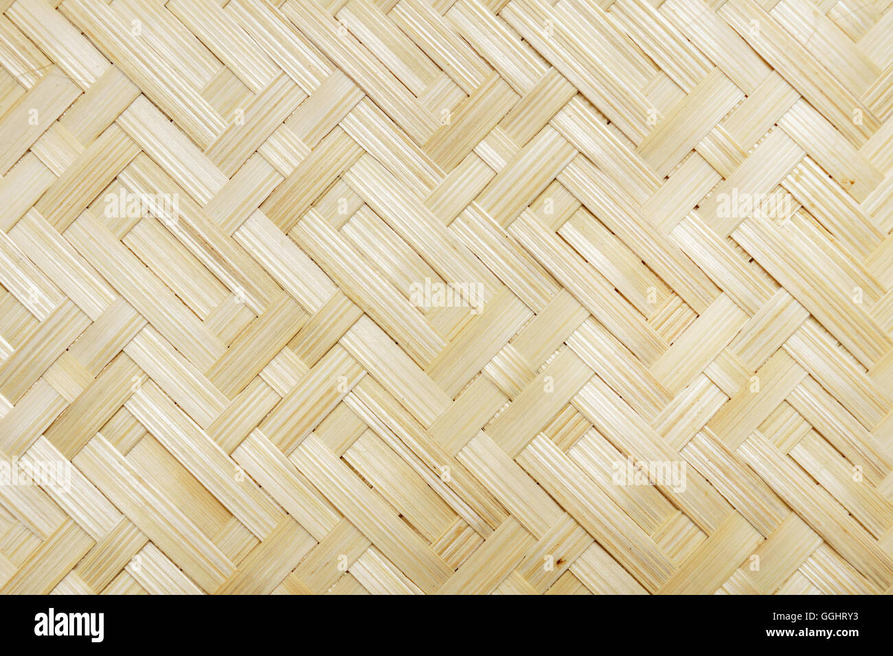 Yellow bamboo wicker weave closeup background texture pattern Stock Photo