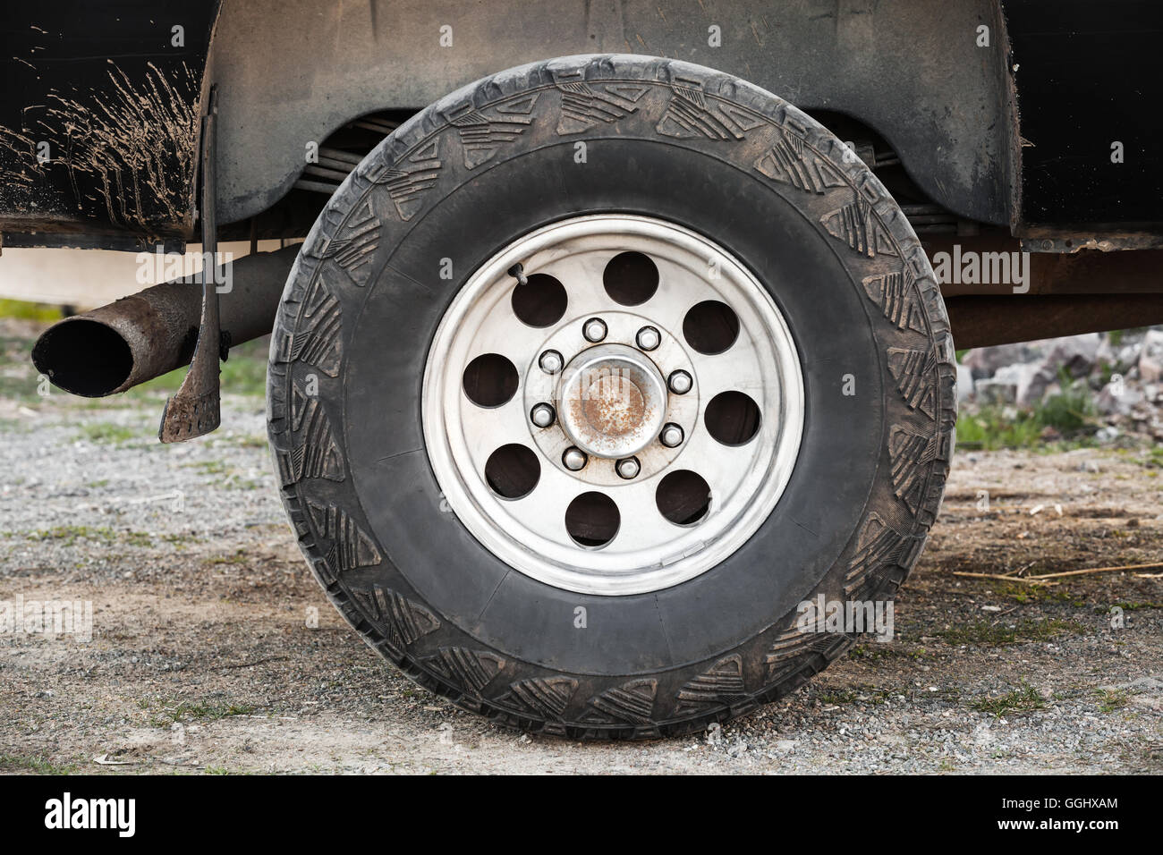 SUV car wheel on dirty rural road, front view Stock Photo