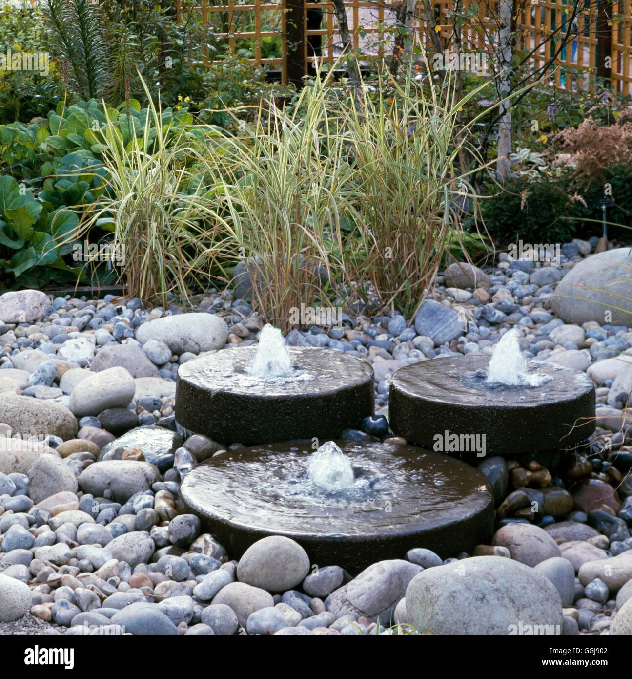 Millstones bubbling waterfeature fountains pebbles stones fountain