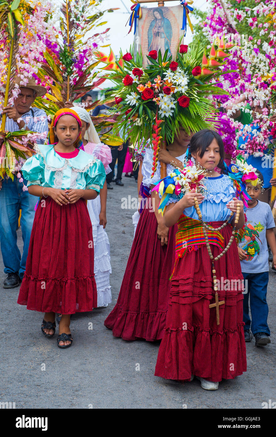 Salvadorian people participate in the procession of the Flower & Palm