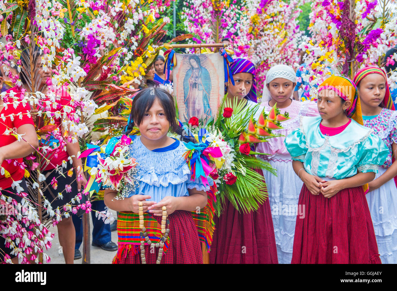 Salvadorian people participate in the procession of the Flower & Palm