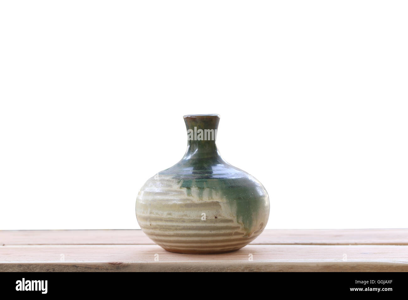 old jar earthenware of japanese style (japanese sake bottle) on wood floor and have clipping paths. Stock Photo