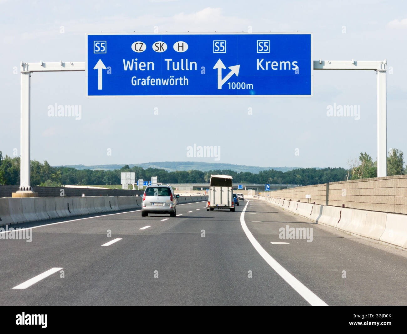 Traffic on highway Autobahn S5 and road sign with directions to Vienna, Lower Austria Stock Photo