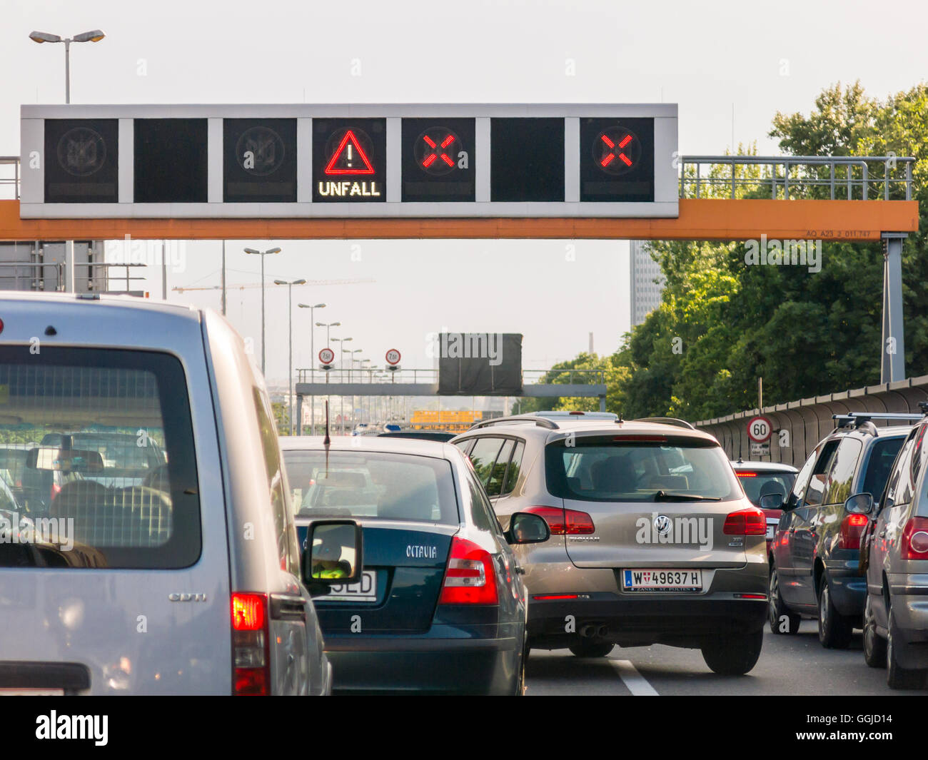 Cars stuck in traffic jam and warning signs after accident on motorway in Vienna, Austria Stock Photo