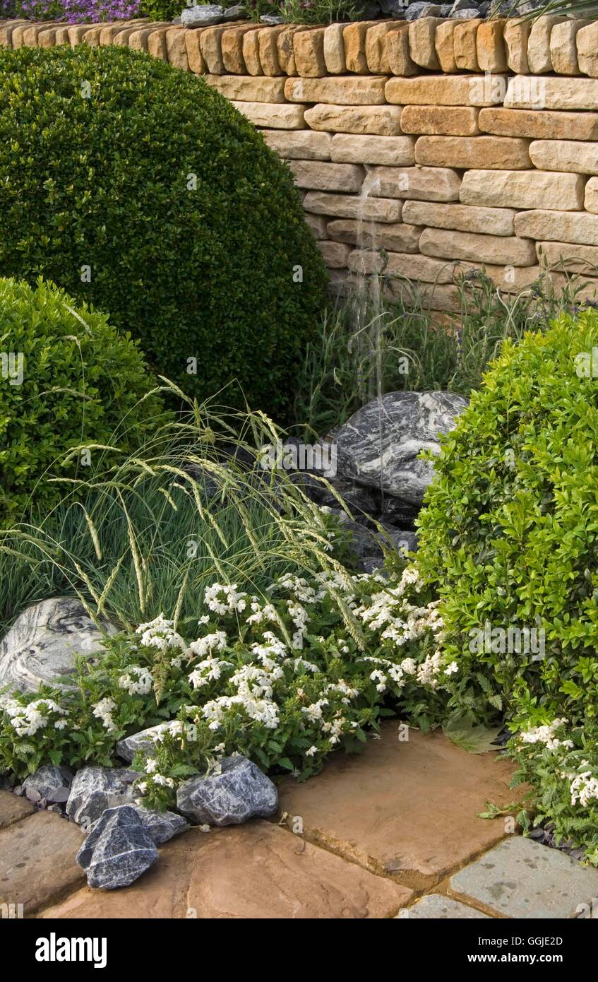 Fountain/Water Feature- - (Please credit: Photos Horticultural/Pavestone UK Ltd/designer Geoff Whiten)   MIW251141  Co Stock Photo