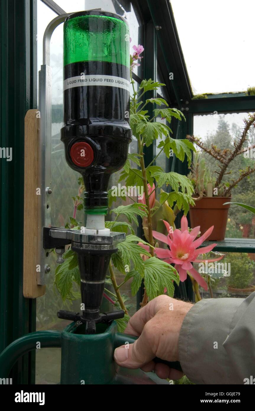 Fertilizer- being dispensed through an ex-alcohol optic   MIW251250  /Photosh Stock Photo