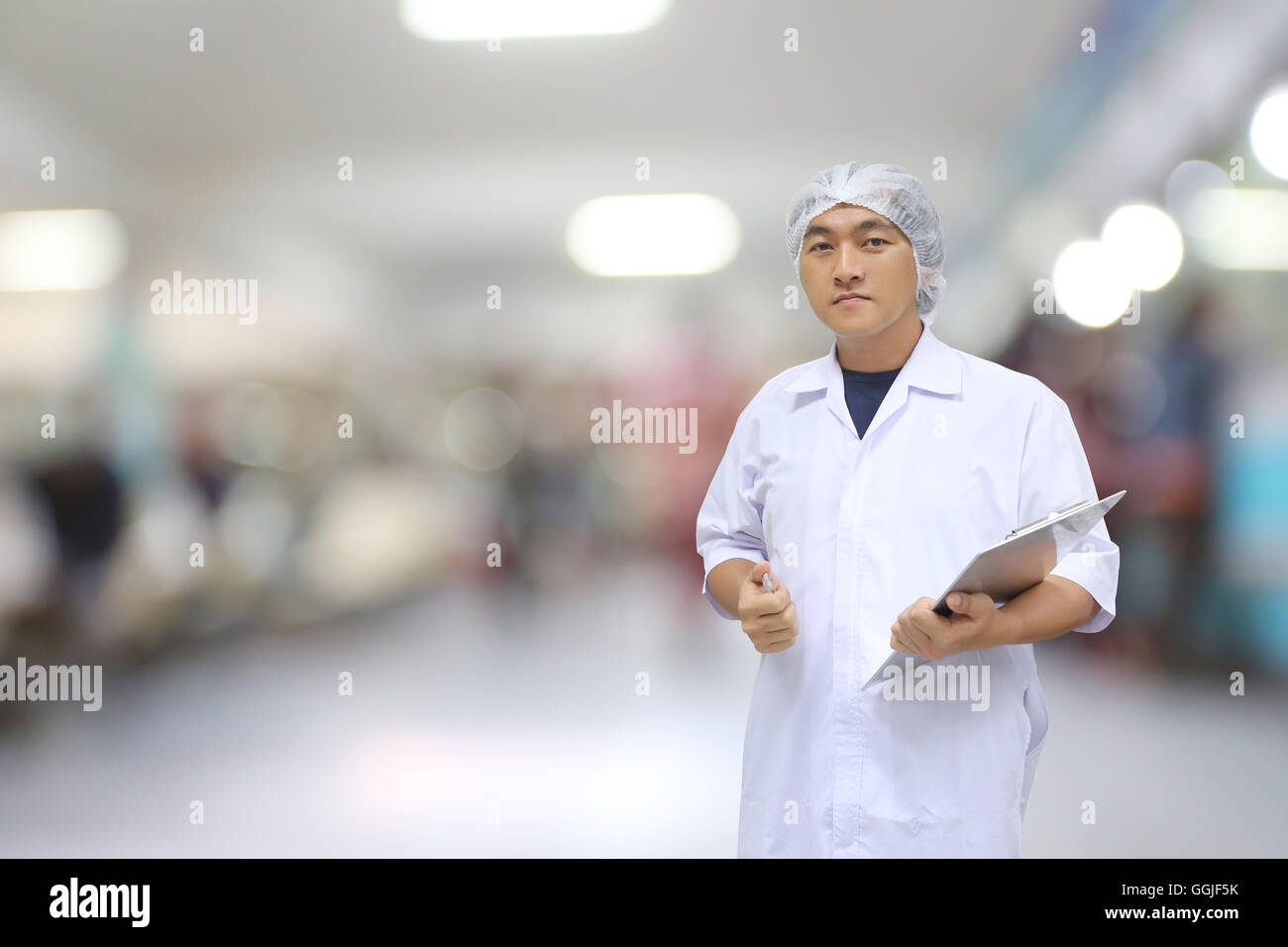 A Man in doctor white dress on interior hospital of blur background for the health concept and medicine. Stock Photo