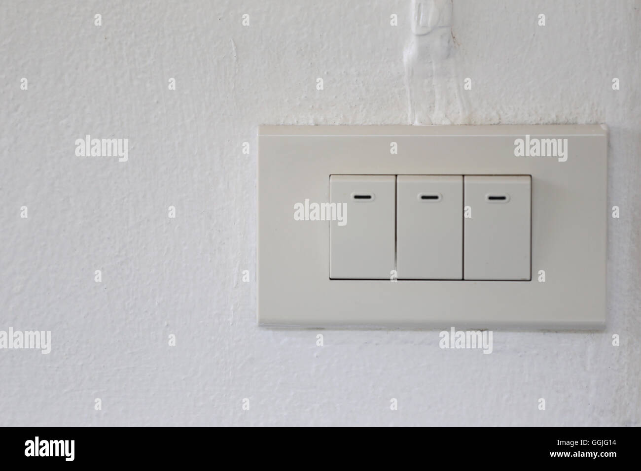 light switch on wall in the house,device plugs for open and close. Stock Photo