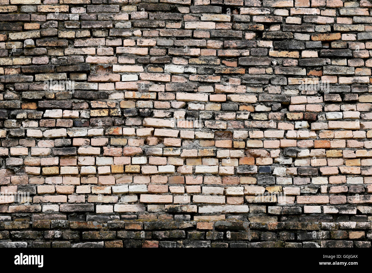 Texture of old weathered brick wall decayed and broken malfunctioning degraded for design background. Stock Photo