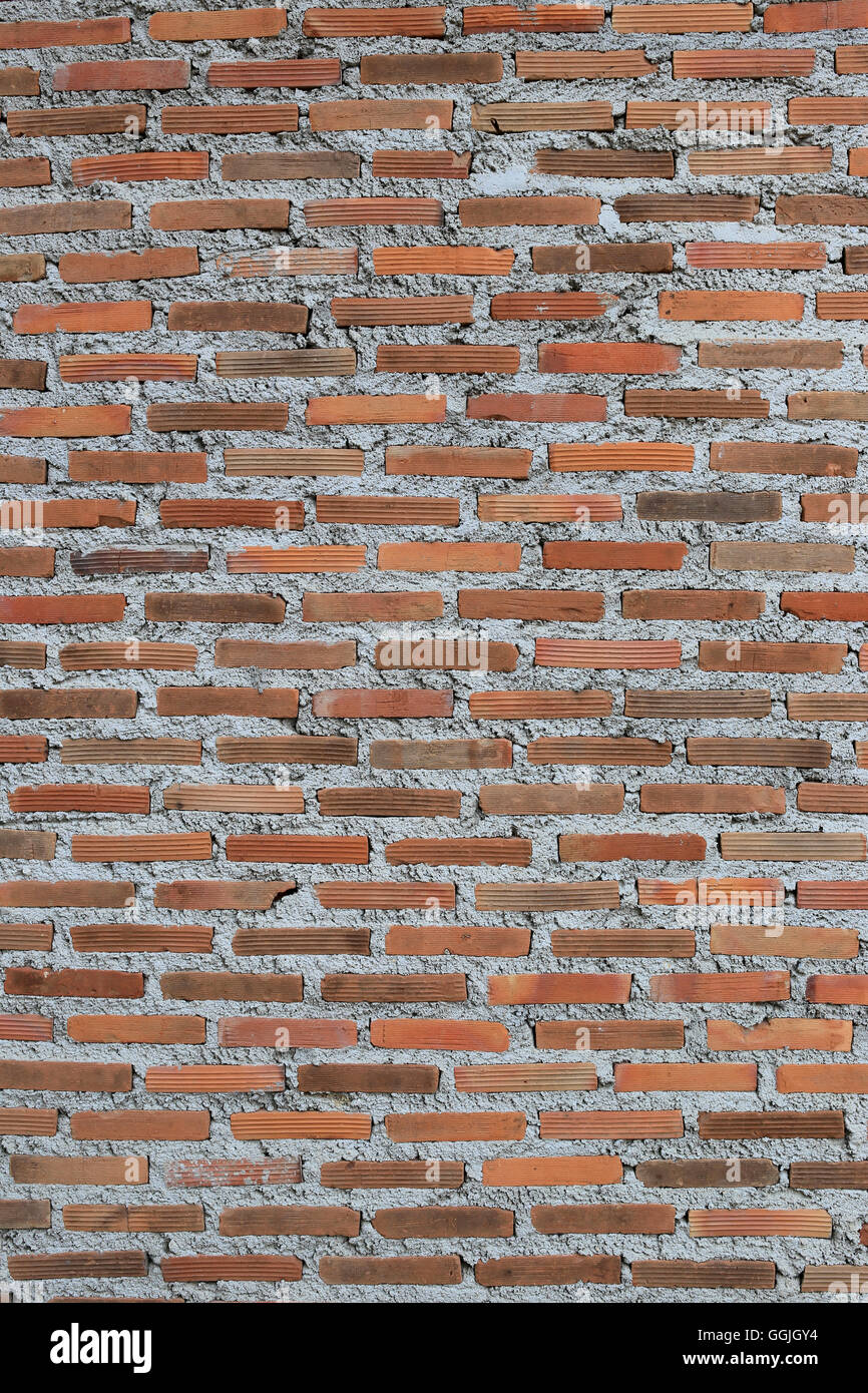 Texture of old weathered brick wall decayed and broken malfunctioning degraded for design background. Stock Photo