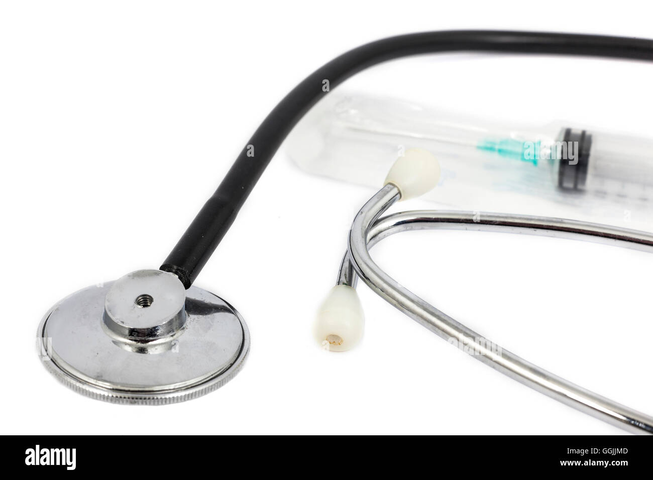 stethoscope and medical syringe with white background Stock Photo - Alamy