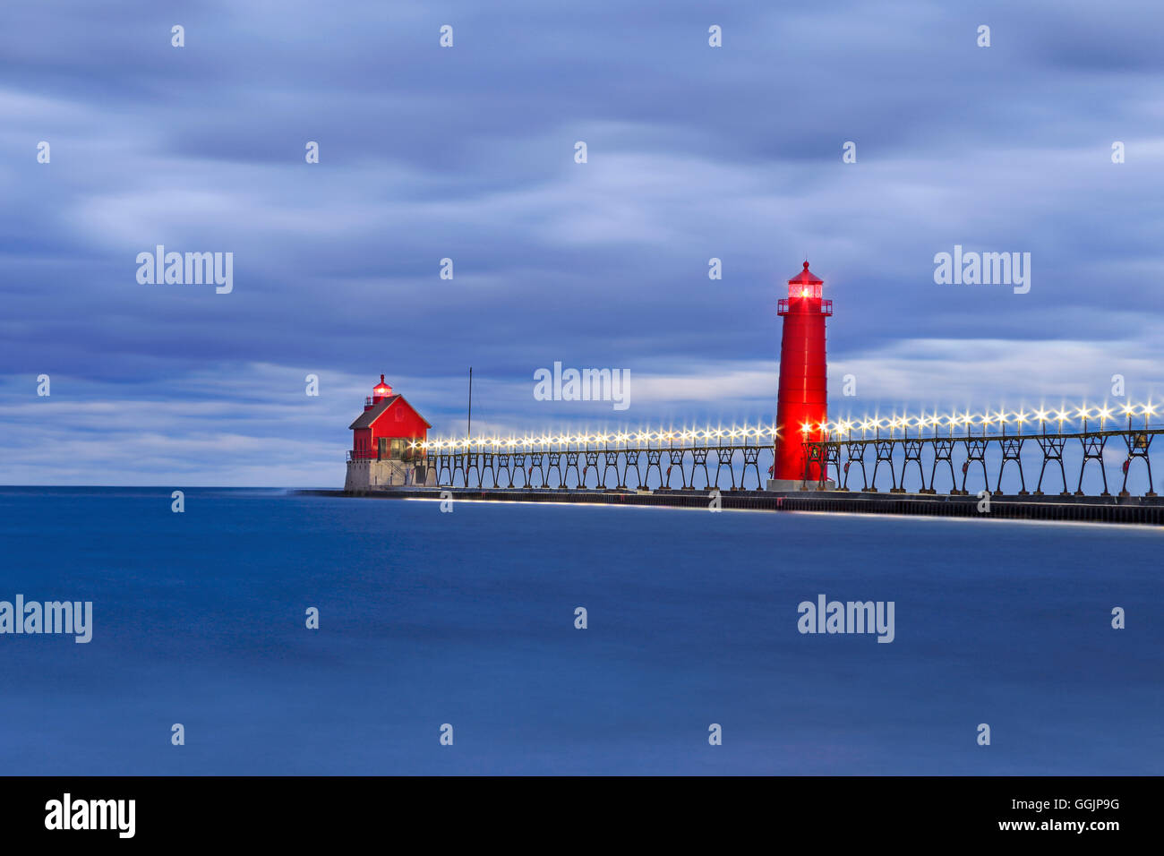 Motion blurred water at the Grand Haven South Pierhead Lighthouse before sunrise, Grand Haven Michigan, USA Stock Photo