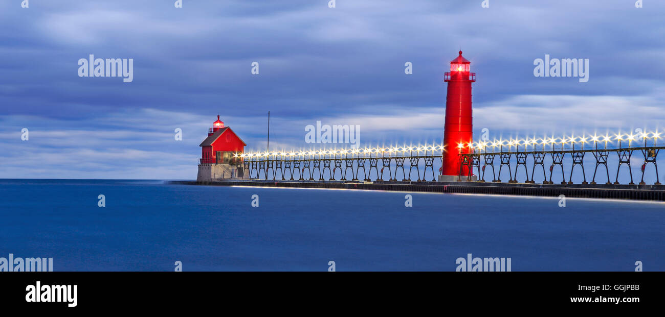Motion blurred water at the Grand Haven South Pierhead Lighthouse before sunrise, Grand Haven Michigan, USA Stock Photo