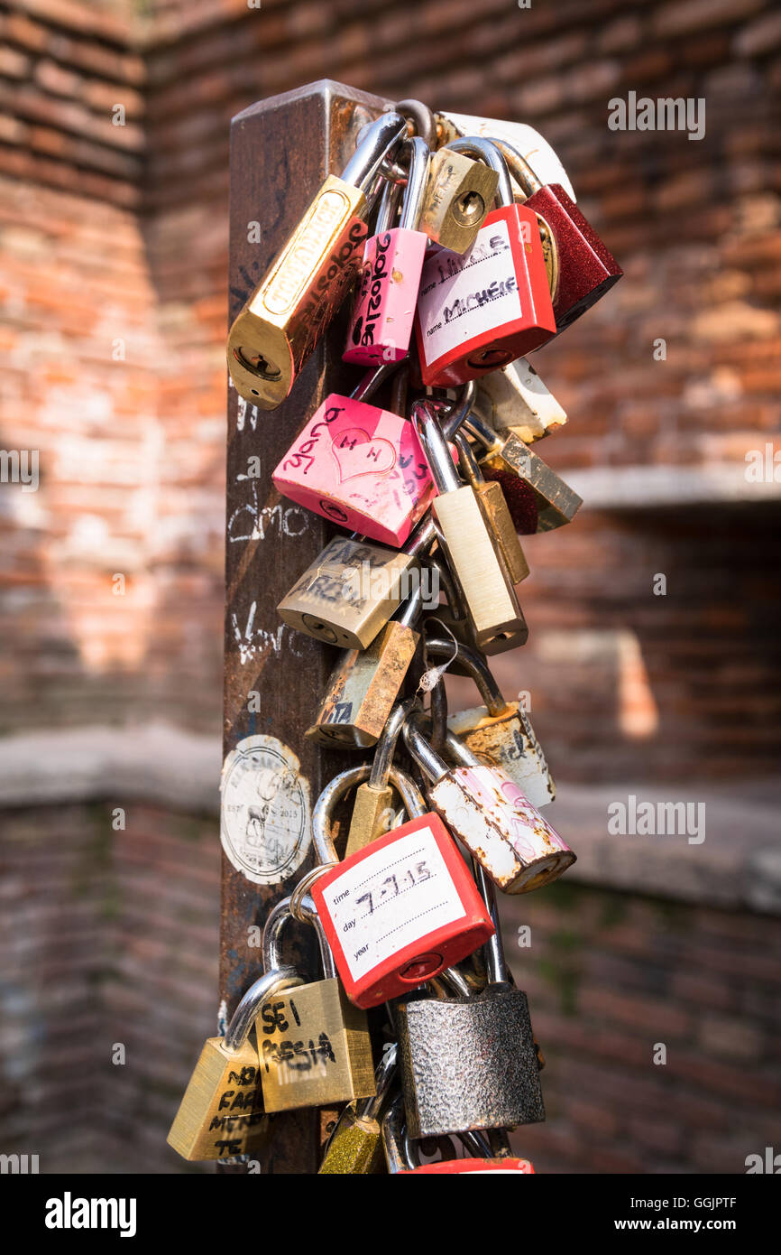 Padlocks left by lovers in Verona as a promise of love. Stock Photo