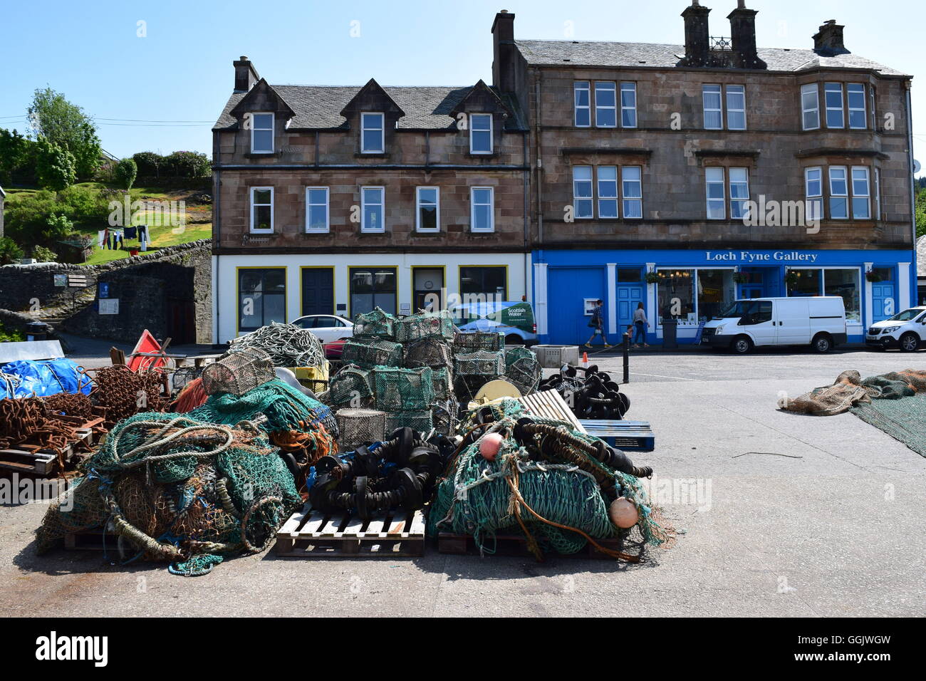Creels and nets at Tarbert harbour Stock Photo