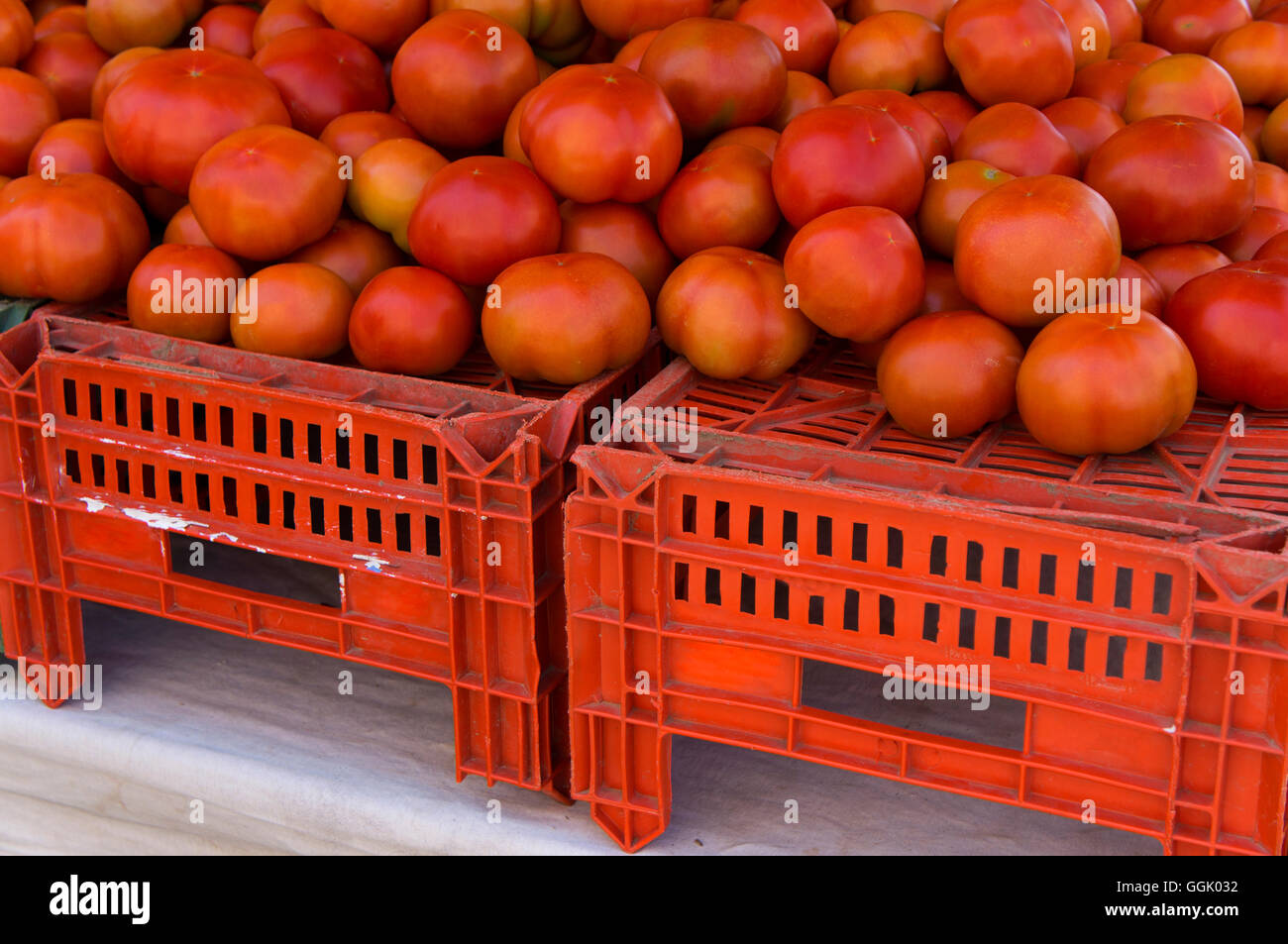 lot of tomatoes on crates for fruit in market Stock Photo