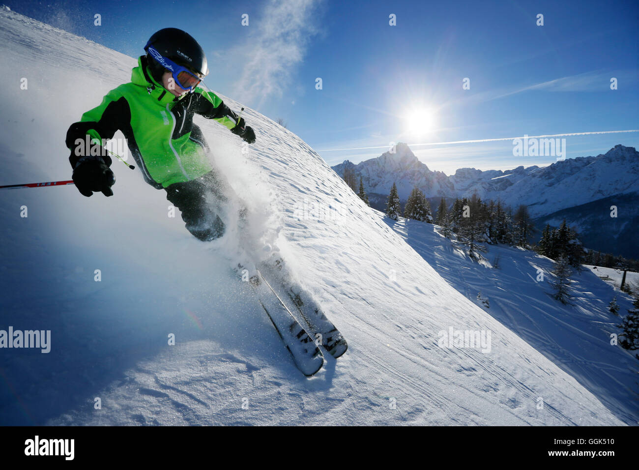 Boy downhill skiing from mount Helm (Monte Elmo), Sexten, South Tyrol, Italy Stock Photo