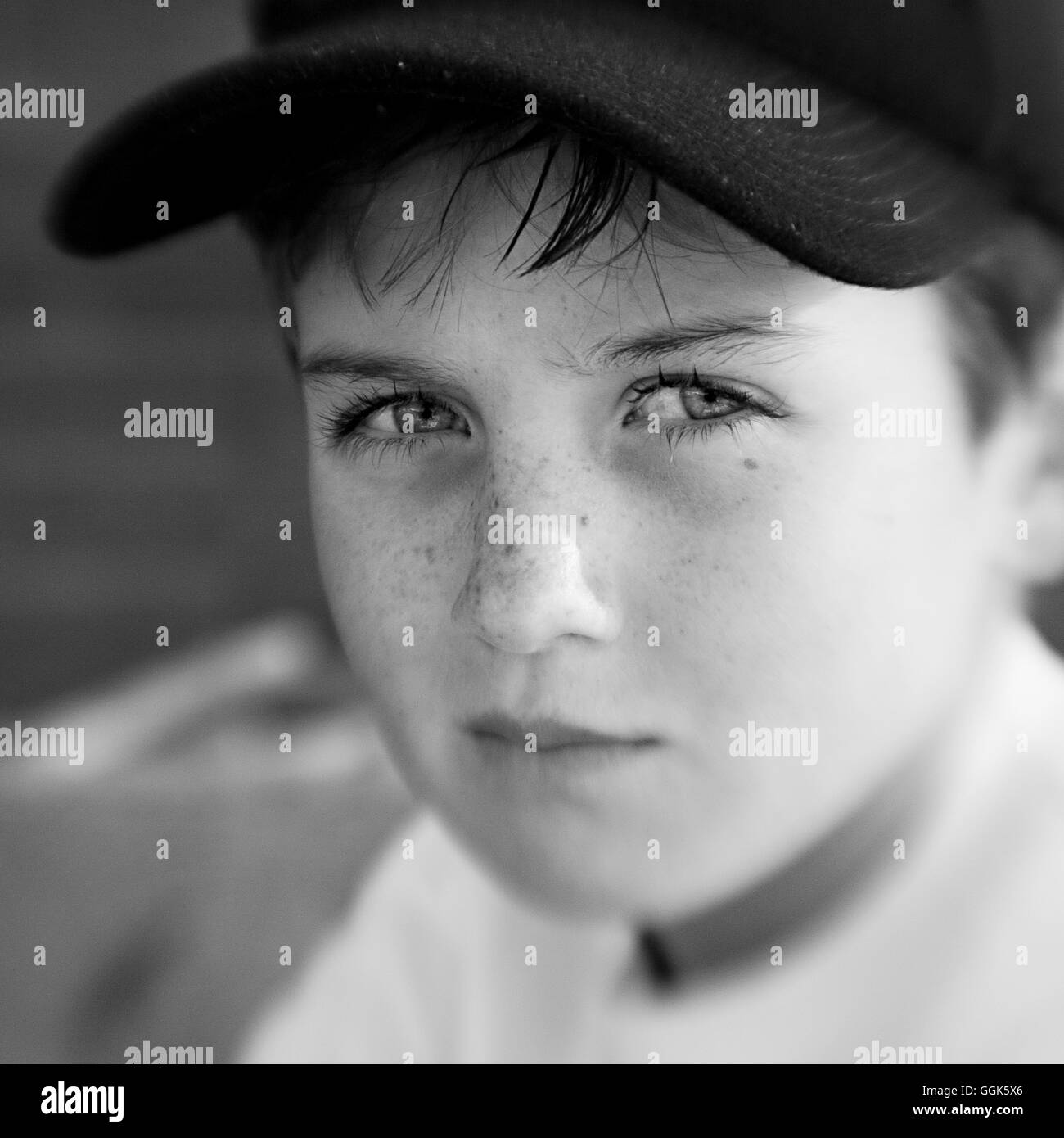 Boy with a cap looking serious (black and white photo using Lensbaby technique), Borden, Western Australia, Australia Stock Photo