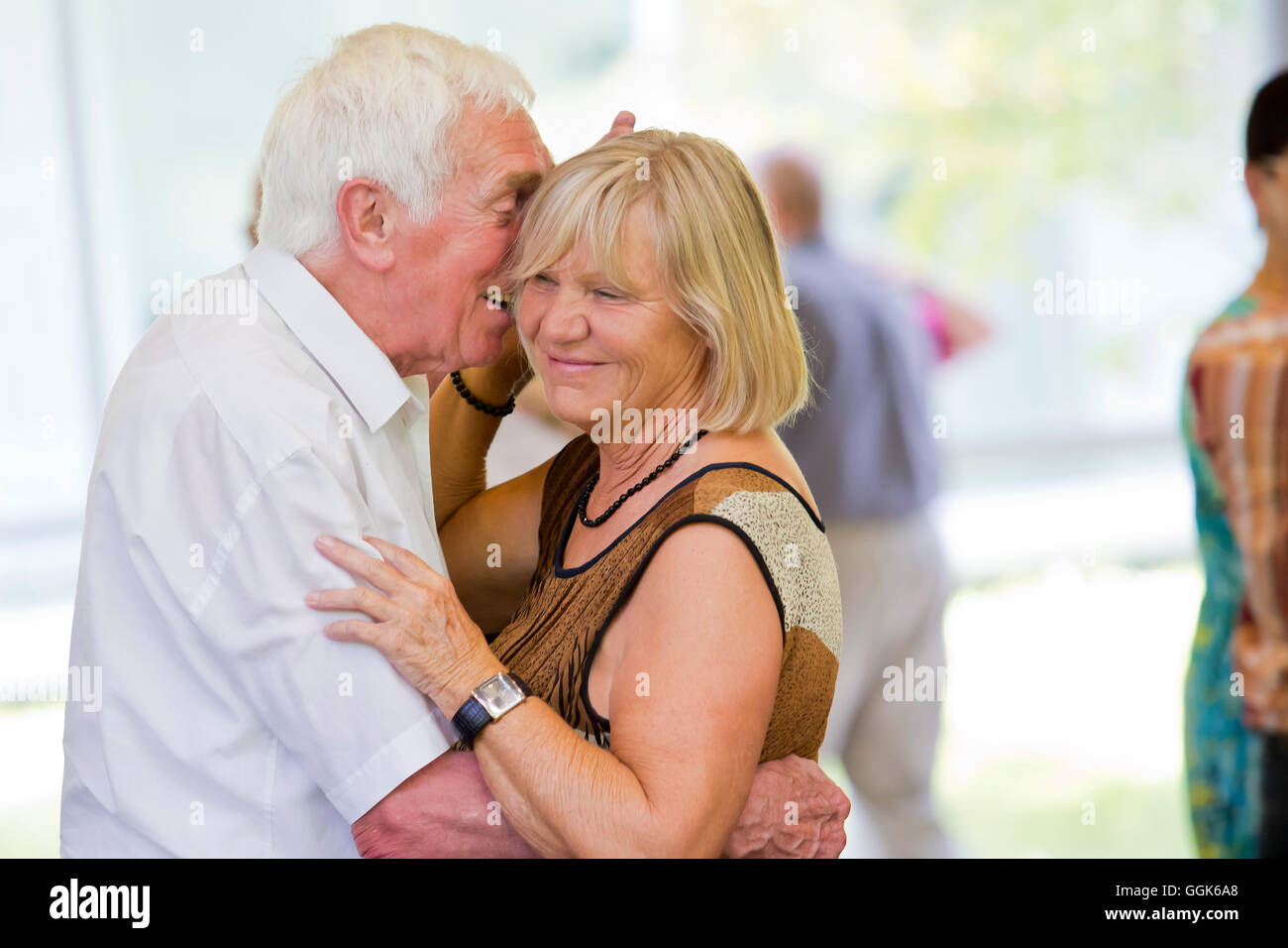 An elderly couple dancing happily together at the afternoon dance in the Wandelhalle Bad Wildungen, Bad Wildungen, Hesse, German Stock Photo